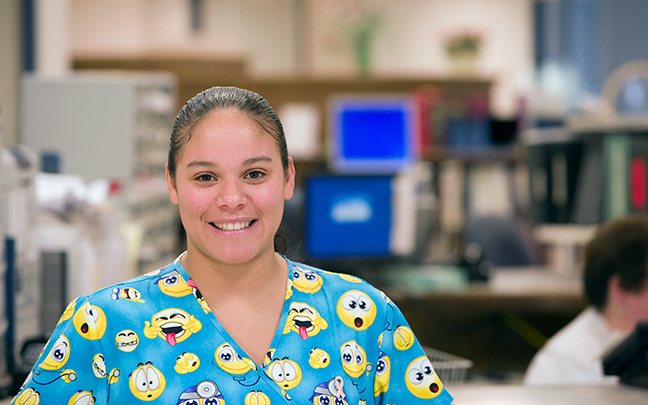 A UConn Health hospital employee smiling at the camera