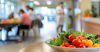 A bowl of vegetable displayed in a cafeteria